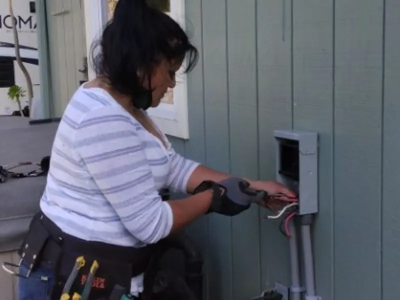 Licensed electrician wiring an exterior subpanel in Mays Chapel